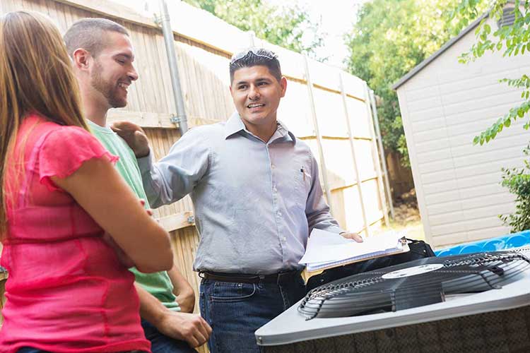 Technician explains homeowners in Dunedin the benefits of HVAC maintenance plan