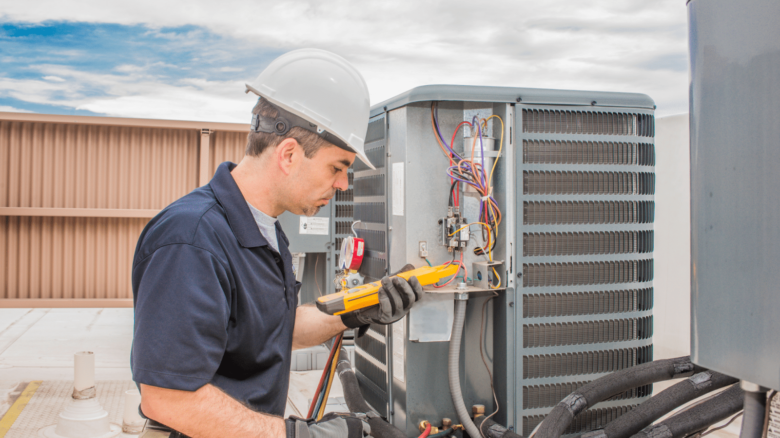 Man working on HVAC unit